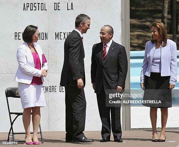 Norwegian Prime Minister Jens Stoltenberg speaks with Mexican President Felipe Calderon next to Norwegian First Lady Ingrid Schulerud and Mexican...