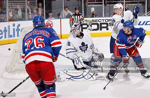 Jonas Gustavsson of the Toronto Maple Leafs protects the net against Erik Christesen and Ryan Callahan of the New York Rangers in the first period on...