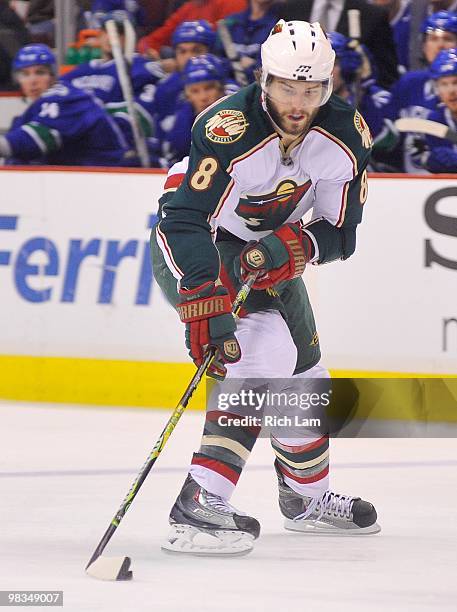 Brent Burns of the Minnesota Wild carries the puck up ice during the NHL game against the Vancouver Canucks on April 04, 2010 at General Motors Place...