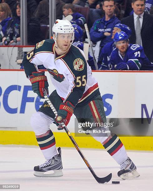 Nick Schultz of the Minnesota Wild carries the puck up ice during the NHL game against the Vancouver Canucks on April 04, 2010 at General Motors...