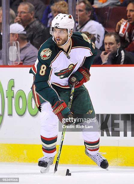 Brent Burns of the Minnesota Wild skates with the puck up ice during the NHL game against the Vancouver Canucks on April 04, 2010 at General Motors...