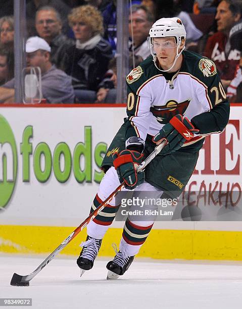 Antti Miettinen of the Minnesota Wild skates with the puck up ice during the NHL game against the Vancouver Canucks on April 04, 2010 at General...
