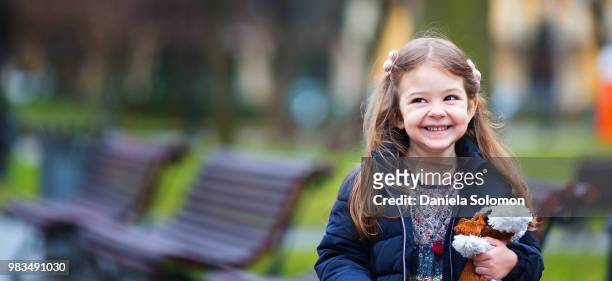 close up of cute little girl - israeli stock-fotos und bilder