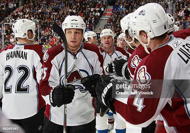 Chris Stewart of the Colorado Avalanche is congratulates by teammates after a goal during the game against the Vancouver Canucks at General Motors...