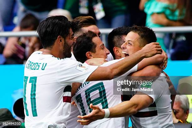 Javier Hernandez of Mexico celebrates with teammates Andres Guardado and Carlos Vela after scoring the second goal of his team during the 2018 FIFA...