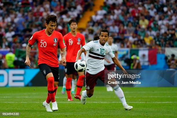 Jang Hyun-Soo of Korea Republic fights for the ball with Giovani Dos Santos of Mexico during the 2018 FIFA World Cup Russia group F match between...