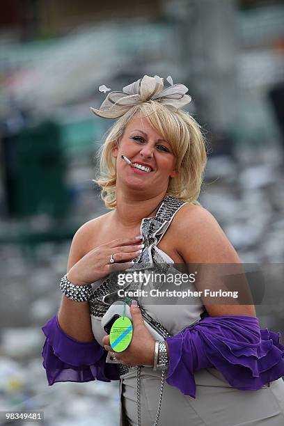 Racegoers make their way home after Ladies Day on the second day of the Grand National meeting at Aintree Racecourse on April 9, 2010 in Aintree,...