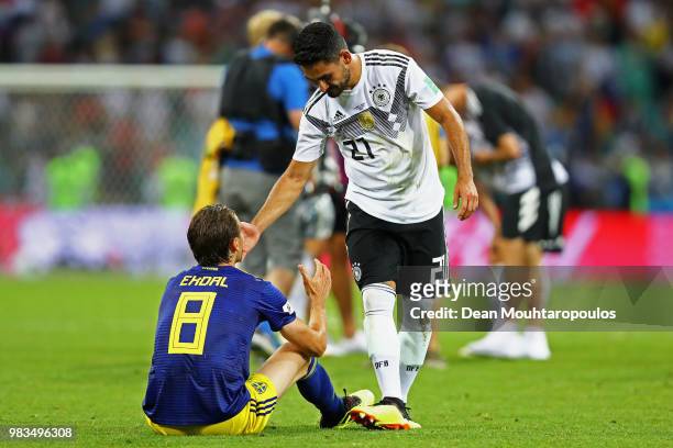 Albin Ekdal of Sweden is consoled by Ilkay Guendogan of Germany following the 2018 FIFA World Cup Russia group F match between Germany and Sweden at...