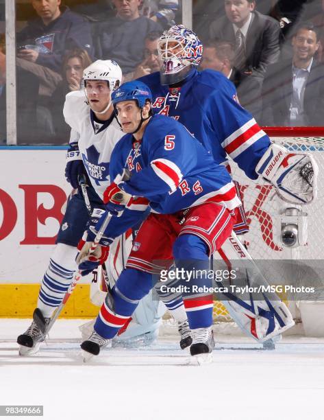 Henrik Lundqvist and Dan Girardi of the New York Rangers protect the net against Viktor Stalberg of the Toronto Maple Leafs on April 7, 2010 at...