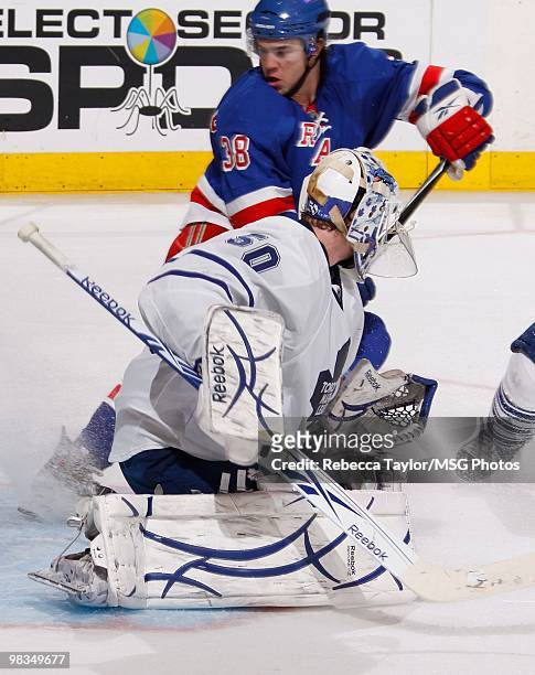 Jonas Gustavsson of the Toronto Maple Leafs protects the net against P.A. Parenteau of the New York Rangers on April 7, 2010 at Madison Square Garden...