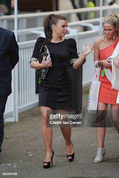 Coleen Rooney departs with friends after Ladies' Day at Aintree Racecourse on April 9, 2010 in Liverpool, England.