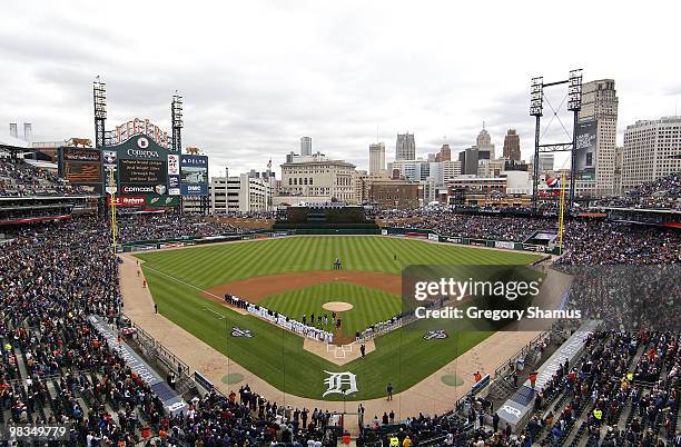 The Detroit Tigers and Cleveland Indians line up for the performance of the National Anthem during Opening Day on April 9, 2010 at Comerica Park in...