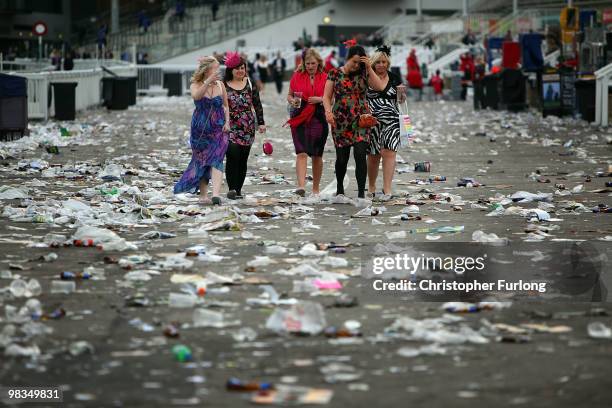 Racegoers make their way home after Ladies Day on the second day of the Grand National meeting at Aintree Racecourse on April 9, 2010 in Aintree,...