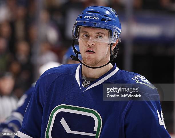 Michael Grabner of the Vancouver Canucks looks on from the bench during the game against the Colorado Avalanche at General Motors Place on April 6,...