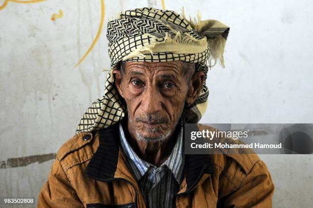 Displaced man who fled the war in Yemen’s port city of Hodeida poses for the camera at a school that becomes his shelter on 23, 2018 in Sana’a, Yemen.