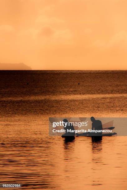 canoeing during the sunset - パラオ ストックフォトと画像