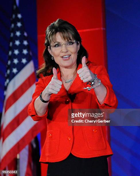 Former Alaska Governor Sarah Palin gives two thumbs up to the audience at the Southern Republican Leadership Conference, April 9, 2010 in New...