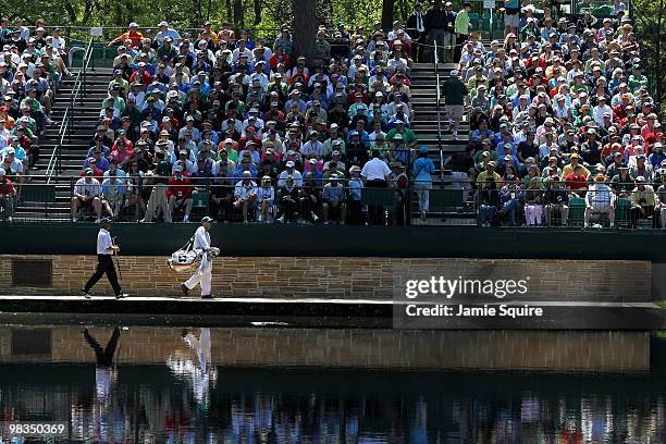 Fred Couples walks with his caddie Joe Lacava on the 15th hole during the second round of the 2010 Masters Tournament at Augusta National Golf Club...