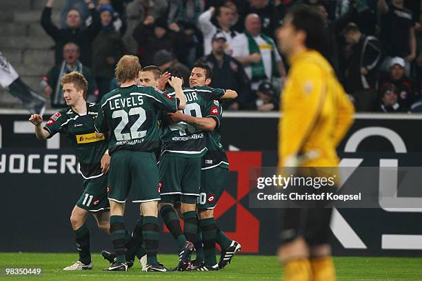 Marco Reus of Gladbach celebrates after scoring the opening goal with team mates during the Bundesliga match between Borussia Moenchengladbach and...