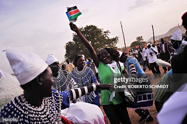 Supporter of current south Sudan leader and head of the SPLM, Sudanese Vice President Salva Kiir, joins others in a dance during a political rally in...