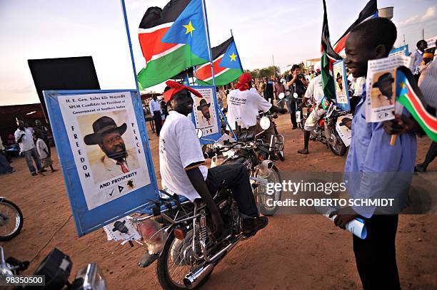 Supporter of current south Sudan leader and head of the SPLM, Sudanese Vice President Salva Kiir, shows off his decked out motor bike to a friend...