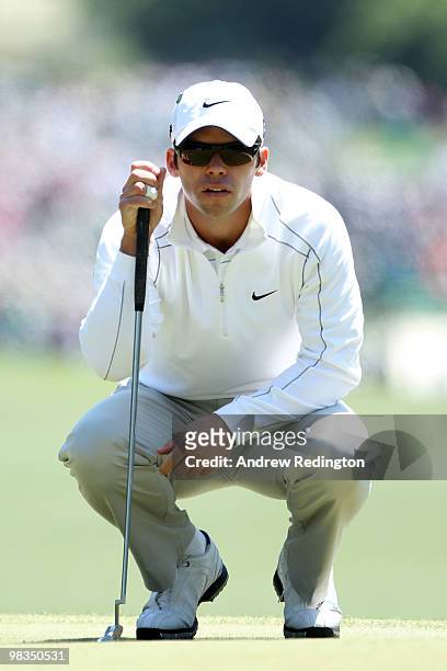 Paul Casey of England lines up a putt on the first hole during the second round of the 2010 Masters Tournament at Augusta National Golf Club on April...