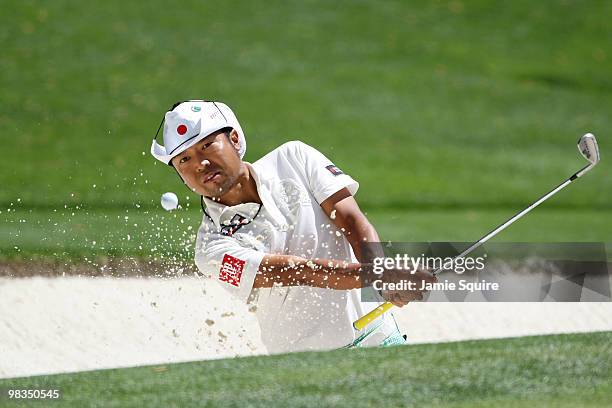 Shingo Katayama of Japan plays a shot from a bunker on the 16th hole during the second round of the 2010 Masters Tournament at Augusta National Golf...