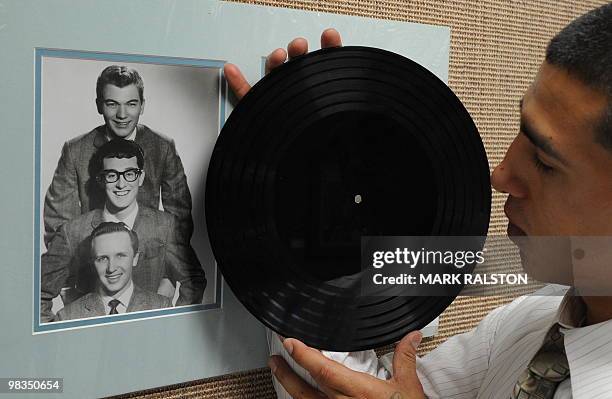 Buddy Holly "Apartment Tapes" six-song acetate record featuring songs recorded weeks before Holly's death on display before an auction of the late...