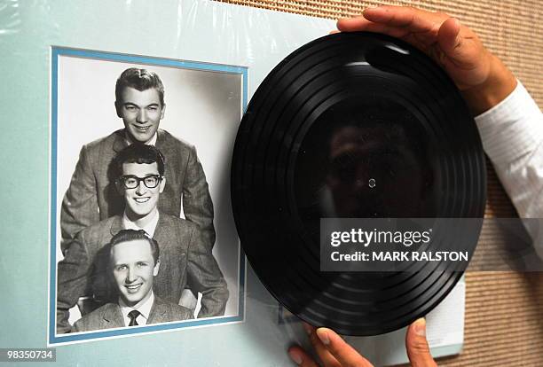Buddy Holly "Apartment Tapes" six-song acetate record featuring songs recorded weeks before Holly's death on display before an auction of the late...