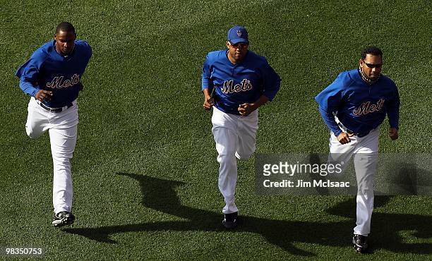 Jenrry Mejia, Francisco Rodriguez, and Pedro Feliciano of the New York Mets warm up before playing against the Florida Marlins on April 8, 2010 at...