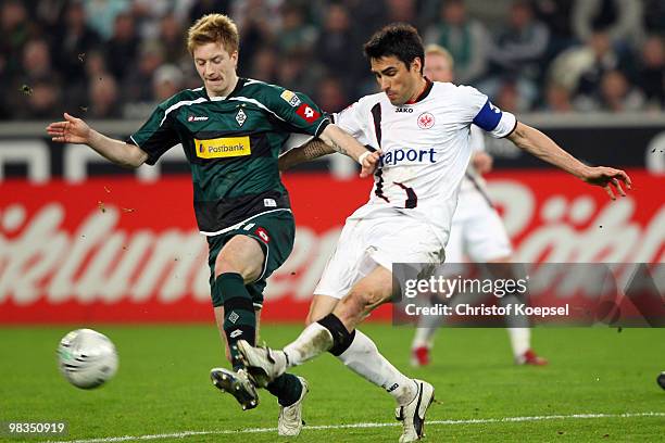 Marco Reus of Gladbach challenges Chris of Franmkfurt during the Bundesliga match between Borussia Moenchengladbach and Eintracht Frankfurt at...