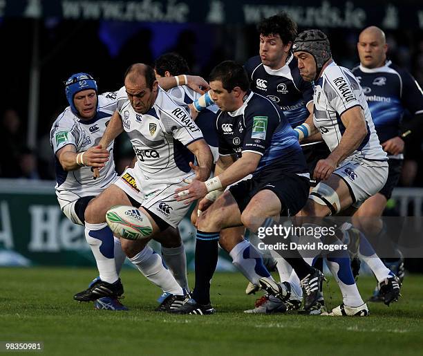 Mario Ledesma of Clermont beats Shane Jennings to the ball during the Heinken Cup quarter final match between Leinster and Clermont Auvergne at the...