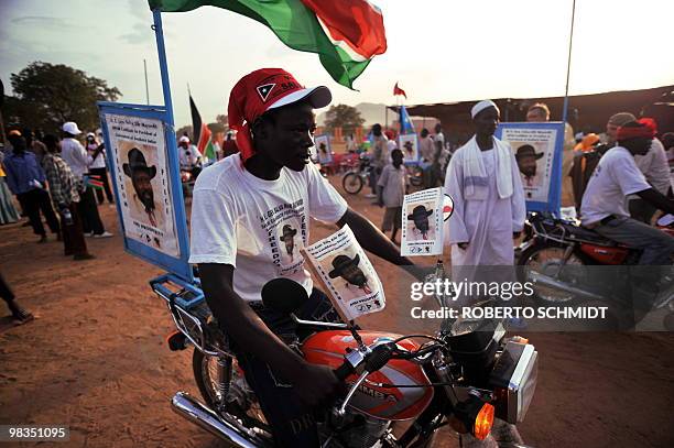 Supporter of current south Sudan leader and head of the SPLM, Sudanese Vice President Salva Kiir, rides his decked out motor bike at the end of a...