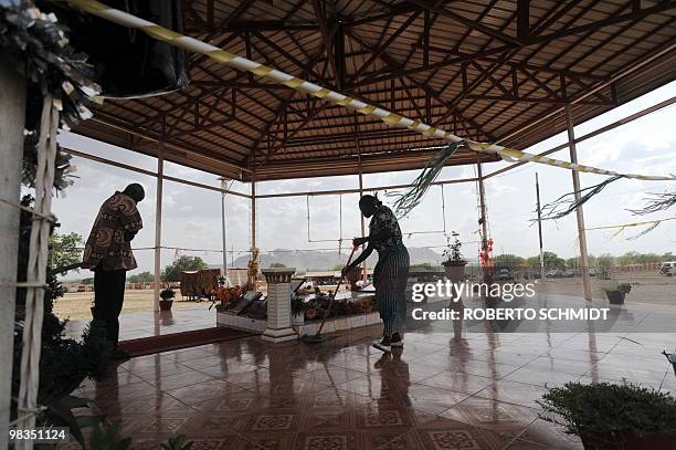 Woman quietly mops the floor of the mausoleum of John Garang, a southern Sudan rebel leader who lead the Sudan People's Liberation Army during a...