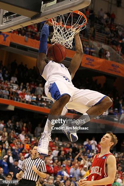 John Wall of the Kentucky Wildcats dunks against the Cornell Big Red during the east regional semifinal of the 2010 NCAA men's basketball tournament...