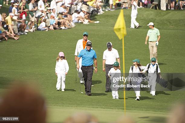 Masters Preview: Phil Mickelson family, daughters Sophia and Amanda and son Evan during Par 3 Contest on Wednesday at Augusta National. Augusta, GA...