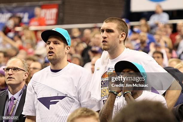 Nate Robinson and Spencer Hawes , former players for the Washington Huskies watch Washington play against the West Virginia Mountaineers during the...