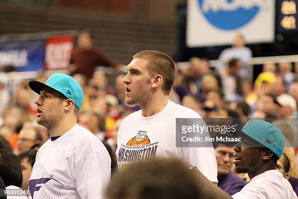 Nate Robinson and Spencer Hawes , former players for the Washington Huskies watch Washington play against the West Virginia Mountaineers during the...