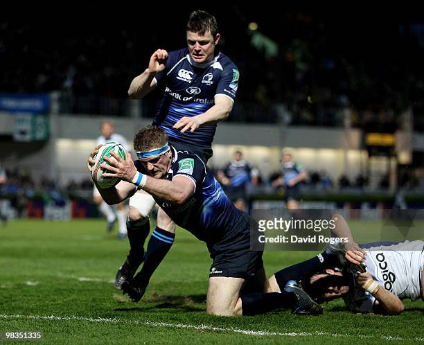 Jamie Heaslip, the Leinster number 8 dives over to score a try during the Heinken Cup quarter final match between Leinster and Clermont Auvergne at...