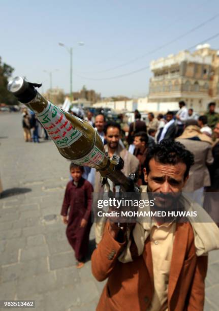 Supporters of the Shiite Yemeni Huthis carries a rocket-propelled grenade launcher as he demonstrates in the capital Sanaa on 25 June 2018, in...