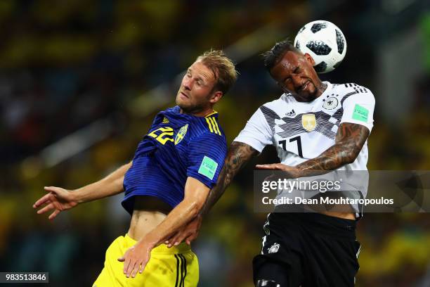 Ola Toivonen of Ola Toivonen battles for the header ball with Jerome Boateng of Germany during the 2018 FIFA World Cup Russia group F match between...