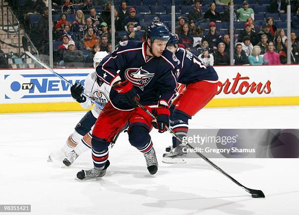 Marc Methot of the Columbus Blue Jackets controls the puck during their NHL game against the Edmonton Oilers on March 15, 2010 at Nationwide Arena in...
