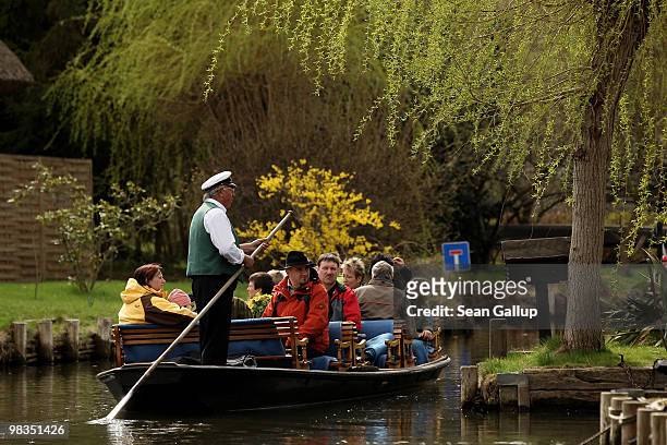 Man ferrying tourists in a pirogue navigates the narrow canals of the Spreewald forest on April 9, 2010 in Luebbenau, Germany. The Spreewald is...