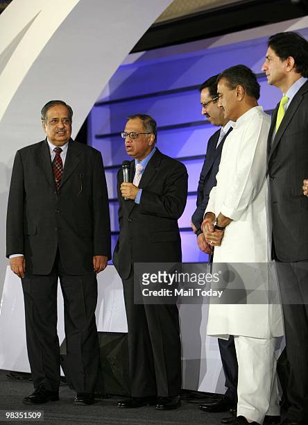 Civil Aviation Minister Praful Patel listen as N R Narayan Murthy, Chairman and chief mentor of the Infosys Technologies Ltd, speaks after receiving...
