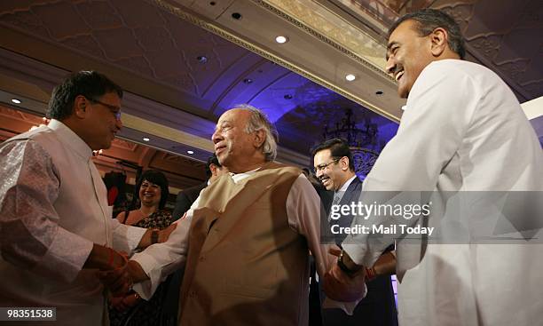 Civil Aviation Minister Praful Patel with RP Goenka, chairman of RPG group during the AIMA Managing India Awards 2010 function in New Delhi on...