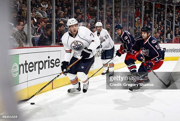 Marc Pouliot of the Edmonton Oilers looks to make a pass play during their NHL game against the Columbus Blue Jackets on March 15, 2010 at Nationwide...