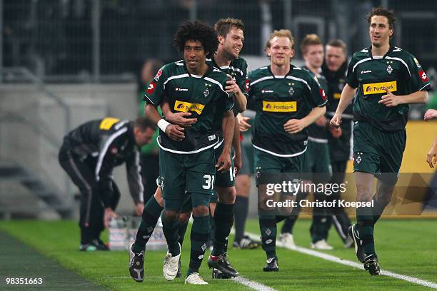 Dante of Gladbach celebrates after scoring his team's second goal with Thorben Marx during the Bundesliga match between Borussia Moenchengladbach and...