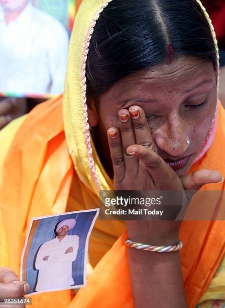 Parents and relatives of 17 Indian youths sentenced to death by a UAE court during a prayer meeting in New Delhi on Wednesday, April 7, 2010.
