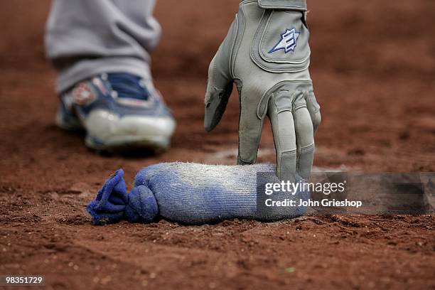 An unidentified player reaches for the rosin bag during the game between the Los Angeles Dodgers and the Pittsburgh Pirates on Thursday, April 8 at...