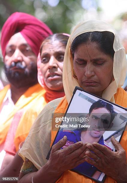 Parents and relatives of 17 Indian youths sentenced to death by a UAE court during a prayer meeting in New Delhi on Wednesday, April 7, 2010.